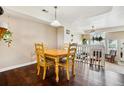 Charming dining area adjacent to the living room, perfect for Gathering meals and entertaining at 8199 Welby Rd # 1903, Denver, CO 80229