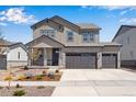 Charming two-story home with a three car garage and beautiful stone accents at 24563 E 34Th Ave, Aurora, CO 80019