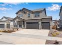 Charming two-story home with a three car garage and beautiful stone accents at 24563 E 34Th Ave, Aurora, CO 80019