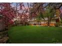 Expansive backyard featuring a lush lawn and a patio area, perfect for outdoor entertaining at 8736 E Easter Ave, Centennial, CO 80112