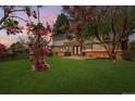 Expansive backyard featuring a lush lawn and a patio area, perfect for outdoor entertaining at 8736 E Easter Ave, Centennial, CO 80112