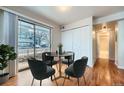 Cozy dining area with a round table and four chairs near sliding doors at 6702 S Ivy Way # A1, Centennial, CO 80112