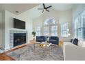 Bright living room featuring a fireplace and bay windows at 6702 S Ivy Way # A1, Centennial, CO 80112