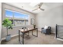 Spacious home office with a ceiling fan and large window at 5018 S Prince Pl, Littleton, CO 80123