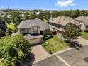 Aerial view of the property showcasing its manicured lawn and its location in a desirable neighborhood at 6449 S Jamaica Cir, Englewood, CO 80111