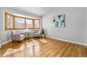 Cozy sitting room with natural light from the bay window, creating a warm and inviting place at 22815 E Progress Ave, Aurora, CO 80015
