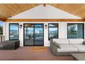 Inviting covered patio with wooden ceiling, comfortable seating and stunning views at 3303 Wolfensberger Rd, Sedalia, CO 80135