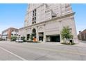 Elegant building entrance featuring covered parking, manicured landscaping, and architectural details at 300 W 11Th Ave # 15C, Denver, CO 80204