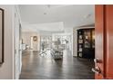 Bright and airy living room featuring dark hardwood floors, modern furnishings, and access to a balcony at 300 W 11Th Ave # 15C, Denver, CO 80204