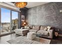 Elegant living room showcases city views, a comfortable sofa, and stylish décor for upscale living at 2001 Lincoln St # 920, Denver, CO 80202