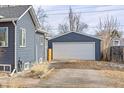 Detached garage with white door, ample parking space at 3736 S Lincoln St, Englewood, CO 80113