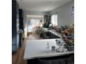 Modern kitchen featuring dark cabinetry and a spacious island at 3736 S Lincoln St, Englewood, CO 80113