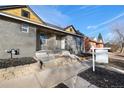 Newly renovated home with gray exterior and rock accents at 2207 E 25Th, Denver, CO 80205