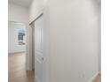 Hallway of home featuring modern light wood flooring and white walls at 6153 N Ceylon St # 307, Denver, CO 80249