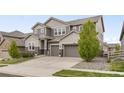 Lovely two-story home with a three car garage and a well manicured front lawn at 16227 Pikes Peak Dr, Broomfield, CO 80023