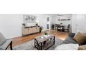 Open concept living space featuring modern decor and a dining area at 1148 N Clinton St, Aurora, CO 80010