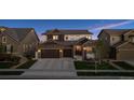 Charming two-story home featuring stone accents, a two-car garage, and a well-manicured lawn at 3056 Yale Dr, Broomfield, CO 80023