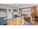 Living room features hardwood floors and a modern fireplace at 3633 N Cook St, Denver, CO 80205