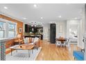 Open living space with hardwood floors and exposed brick wall at 3633 N Cook St, Denver, CO 80205