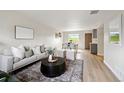 Inviting living room showcasing a neutral color palette, hardwood floors, and an open layout to the dining area at 9740 W 104Th Dr, Westminster, CO 80021
