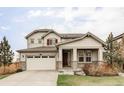 Two-story home with inviting front porch and attached two-car garage at 500 176Th Ave, Broomfield, CO 80023