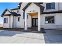 Beautiful front entrance featuring double doors and stone accents at 16250 Kenosha St, Brighton, CO 80603