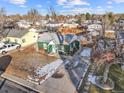 Aerial view showcasing the home's location in a quiet neighborhood with mature trees and well-kept lawns at 1250 S Tennyson St, Denver, CO 80219