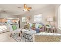 Bright living room featuring neutral tones, modern furnishings, and seamless flow into the kitchen at 1250 S Tennyson St, Denver, CO 80219