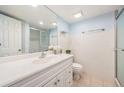 Clean bathroom with white vanity, tiled shower, and a mirror at 14204 E Baltic Cir, Aurora, CO 80014