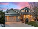 Charming two-story home with stone accents, a cozy front porch, basketball hoop and professional landscaping at 24547 E Easter Pl, Aurora, CO 80016