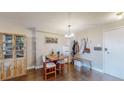 Small dining area with a wooden table and chairs near the entryway at 1029 E 8Th Ave # 501, Denver, CO 80218