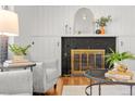 Stylish living room showcasing a black brick fireplace, mantle, and modern decor at 3400 Garland St, Wheat Ridge, CO 80033