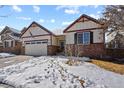 Inviting single-Gathering home with a two-car garage and a neatly maintained front yard at 10153 Pagosa St, Commerce City, CO 80022