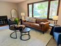 Inviting living room with natural light, stylish furniture, and view of the outdoors at 53 Douglas S Dr, Broomfield, CO 80020