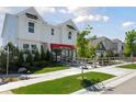 Inviting two-story home with manicured lawn, lovely trees, and a welcoming entrance at 13326 Blue Amber Ct, Parker, CO 80134