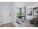 Bright foyer featuring a stylish work space with sleek desk, decor, and natural light at 13326 Blue Amber Ct, Parker, CO 80134