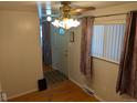 Inviting entryway with a decorative ceiling fan and a classic front door at 5370 W Arizona Pl, Lakewood, CO 80232