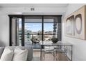 Cozy dining area with views of the city skyline at 1750 Wewatta St # 1301, Denver, CO 80202