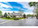 A well-maintained home on a corner lot with mature trees near a gated entry to a community at 3802 Lee Cir, Wheat Ridge, CO 80033