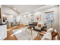 Bright living room boasts hardwood floors, neutral paint, and ample natural light at 1430 Fairfax St, Denver, CO 80220