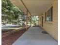 View of the covered porch and walkway to the front door of the home at 2236 S Osceola St, Denver, CO 80219