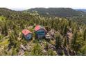 Beautiful home and guest house nestled among the trees on the mountain at 3945 Douglas Mountain Dr, Golden, CO 80403