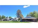 Expansive backyard with hangar/garage, boasting ample space and potential for various activities and hobbies at 15945 Delta Ct, Brighton, CO 80603