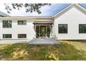 Front entrance with double doors and stylish awning at 922 W Wolfensberger Rd, Castle Rock, CO 80109