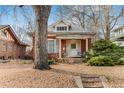 Quaint brick home with a tree-lined yard at 1317 S University Blvd, Denver, CO 80210