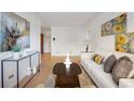 Inviting living room with hardwood floors, stylish decor, and plenty of natural light at 1454 Jersey St # 2, Denver, CO 80220