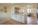 Bright and open kitchen with counter seating at 9390 W Alabama Dr, Lakewood, CO 80232