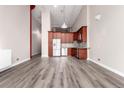 Spacious living area with updated kitchen, light gray flooring, and plenty of natural light at 720 16Th St # 207, Denver, CO 80202