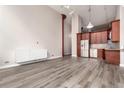 Spacious living area with updated kitchen, light gray flooring, and plenty of natural light at 720 16Th St # 207, Denver, CO 80202