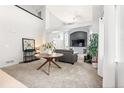 Bright living room featuring high ceilings, neutral carpet, and ample space for comfortable seating at 6650 Stagecoach Ave, Firestone, CO 80504
